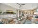 Inviting living room with stylish seating, open floor plan, and seamless connection to the kitchen at 7668 Registrar Way, Sarasota, FL 34243