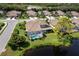 Aerial view of homes with pools in a neighborhood with mature landscaping and several ponds at 8737 Pebble Creek Ln, Sarasota, FL 34238