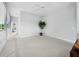 Second floor bedroom with neutral carpet and paint, as well as a view down the hallway at 8737 Pebble Creek Ln, Sarasota, FL 34238