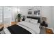 Modern bedroom with a large bed, stylish decor, and ample natural light at 8737 Pebble Creek Ln, Sarasota, FL 34238