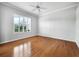 Bright bedroom with beautiful window and plantation shutters and hardwood flooring at 8737 Pebble Creek Ln, Sarasota, FL 34238
