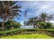 Stonebrook clubhouse sign in front of a flowering landscape at 8737 Pebble Creek Ln, Sarasota, FL 34238