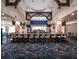 Clubhouse bar with seating and TVs, featuring high ceilings and unique wood trim at 8737 Pebble Creek Ln, Sarasota, FL 34238