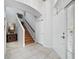 Inviting foyer with tiled floors, stairs, and a bright front door, creating a welcoming entry to the home at 8737 Pebble Creek Ln, Sarasota, FL 34238