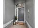 Front door features sidelight, transom window, and welcome mat at 8737 Pebble Creek Ln, Sarasota, FL 34238