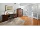 Home office with dark wood furniture, neutral carpet and french door access at 8737 Pebble Creek Ln, Sarasota, FL 34238