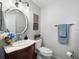 Charming powder room with a decorative mirror, marble countertop, and stylish accents at 8737 Pebble Creek Ln, Sarasota, FL 34238