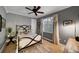 Bedroom featuring a ceiling fan, neutral carpet and walls, and natural light at 11432 Savannah Lakes Dr, Parrish, FL 34219