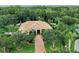 Stunning home with lush landscaping, brick driveway and neutral paint nestled in a wooded area at 11432 Savannah Lakes Dr, Parrish, FL 34219