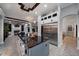 The open kitchen boasts stainless steel appliances, a large island, and granite countertops at 11432 Savannah Lakes Dr, Parrish, FL 34219