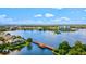 Beautiful aerial view of a serene lake and surrounding residences, offering tranquil waterfront living at 130 Riviera Dunes Way # 1104, Palmetto, FL 34221