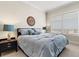 Cozy bedroom with a comfortable bed, nightstands, and a view from the window at 130 Riviera Dunes Way # 1104, Palmetto, FL 34221