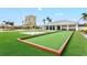 Enjoy outdoor activities with the well-kept bocce ball court surrounded by lush greenery and inviting spaces at 130 Riviera Dunes Way # 1104, Palmetto, FL 34221