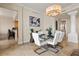 Elegant dining room with a modern glass table, seating for six, and a stylish chandelier at 130 Riviera Dunes Way # 1104, Palmetto, FL 34221