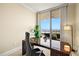 Office space with a large desk, chair, and views of the ocean from the balcony at 130 Riviera Dunes Way # 1104, Palmetto, FL 34221