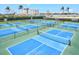 Overhead shot of professional pickleball courts surrounded by hotels and restaurants at 130 Riviera Dunes Way # 1104, Palmetto, FL 34221