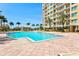 Inviting pool area with lounge chairs and a gazebo, perfect for relaxation and entertainment at 130 Riviera Dunes Way # 1104, Palmetto, FL 34221