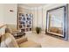Cozy reading room with comfortable seating, bookshelf, and decorative mirror at 130 Riviera Dunes Way # 1104, Palmetto, FL 34221