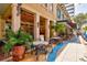 Charming restaurant patio with ample outdoor seating, perfect for enjoying a meal in a relaxed setting at 130 Riviera Dunes Way # 1104, Palmetto, FL 34221