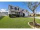 Charming two-story home with a well-manicured lawn, garage, and inviting entrance at 15404 Trinity Fall Way, Bradenton, FL 34212