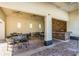 Outdoor seating area with multiple tables and a stone bar at 15404 Trinity Fall Way, Bradenton, FL 34212