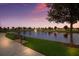 Scenic view of a pond with a fountain and park bench at 15404 Trinity Fall Way, Bradenton, FL 34212