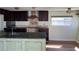 Kitchen featuring an island, dark wood cabinets, and updated countertops at 2601 Gulf N Dr # 510, Bradenton Beach, FL 34217