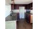 Kitchen featuring an island, dark wood cabinets, and updated countertops at 2601 Gulf N Dr # 510, Bradenton Beach, FL 34217