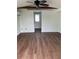Bright living room with wood floors and a ceiling fan at 2601 Gulf N Dr # 510, Bradenton Beach, FL 34217