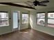 Bright sun room featuring multiple windows, natural light, and wood floors at 2601 Gulf N Dr # 510, Bradenton Beach, FL 34217