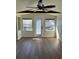 Sun room featuring multiple windows, natural light, and wood floors at 2601 Gulf N Dr # 510, Bradenton Beach, FL 34217
