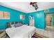 Bright blue bedroom with access to ensuite bathroom and hallway at 327 Hernando Ave, Sarasota, FL 34243