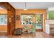 Cozy dining area adjacent to the kitchen, offering a view of the backyard pool and patio at 327 Hernando Ave, Sarasota, FL 34243