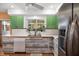 Bright kitchen featuring wood counters, stainless steel refrigerator, tiled backsplash, and outdoor view at 327 Hernando Ave, Sarasota, FL 34243