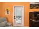 Bright living room featuring a back door to the patio and a charming aquarium at 327 Hernando Ave, Sarasota, FL 34243