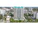 An aerial shot captures this upscale condo and its appealing location among city buildings and mature trees at 340 S Palm Ave # Pl1, Sarasota, FL 34236