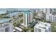 Stunning aerial view of a luxury high-rise condo building with views of the bay and the cityscape at 340 S Palm Ave # Pl1, Sarasota, FL 34236