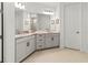 Bathroom featuring a double vanity with under sink cabinets and chrome hardware at 3704 Wild Blossom Pl, Parrish, FL 34219