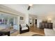 Bright living room seamlessly transitions to the outdoor lanai with easy access to the kitchen at 3858 Casey Key, Nokomis, FL 34275