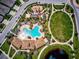 Overhead view of community with pool, playground, green space, and walking paths at 452 Tierra Verde Way, Bradenton, FL 34212