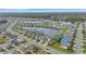 Aerial view of the community showcasing lake and surrounding houses at 452 Tierra Verde Way, Bradenton, FL 34212