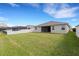 Large backyard and covered patio area offers ample space for outdoor relaxation and entertainment at 452 Tierra Verde Way, Bradenton, FL 34212