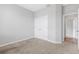 Spacious bedroom featuring a closet and views into the hall and adjoining room at 452 Tierra Verde Way, Bradenton, FL 34212