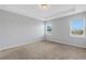 Bright bedroom with two large windows and neutral carpet flooring at 452 Tierra Verde Way, Bradenton, FL 34212