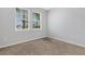 Neutral bedroom featuring two bright windows at 452 Tierra Verde Way, Bradenton, FL 34212