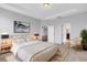 Relaxing bedroom featuring a soft bed, minimalist decor, and an ensuite bathroom at 452 Tierra Verde Way, Bradenton, FL 34212