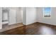 Bedroom featuring hardwood floors and a window at 452 Tierra Verde Way, Bradenton, FL 34212