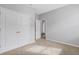 Neutral bedroom with a carpet, closet, a white door, and a window at 452 Tierra Verde Way, Bradenton, FL 34212