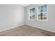 Neutral bedroom featuring two bright windows at 452 Tierra Verde Way, Bradenton, FL 34212