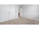 Bright bedroom features neutral carpet, fresh paint, and a double-door closet at 452 Tierra Verde Way, Bradenton, FL 34212